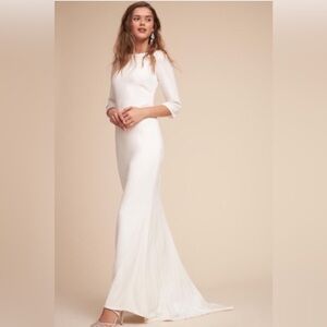 Elegant yet simple wedding dress, boat neck, ¾ sleeves, full length with train.